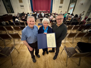 David Salstein, Karen Walz, and Music Director Michael Korn with Waltham City Council Resolution.